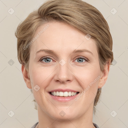 Joyful white adult female with medium  brown hair and grey eyes