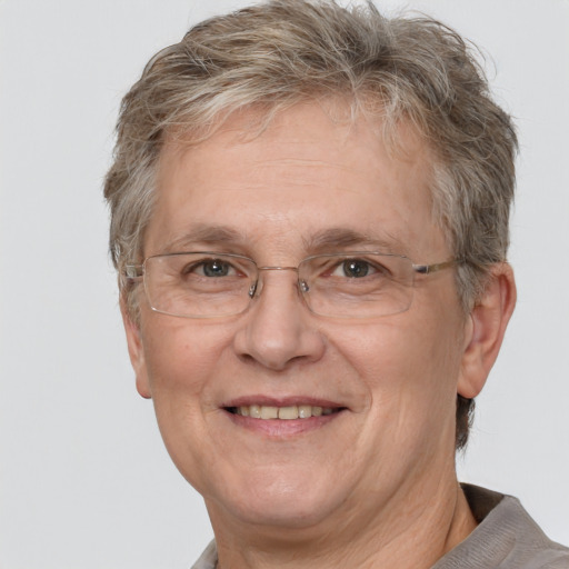 Joyful white middle-aged male with short  brown hair and grey eyes