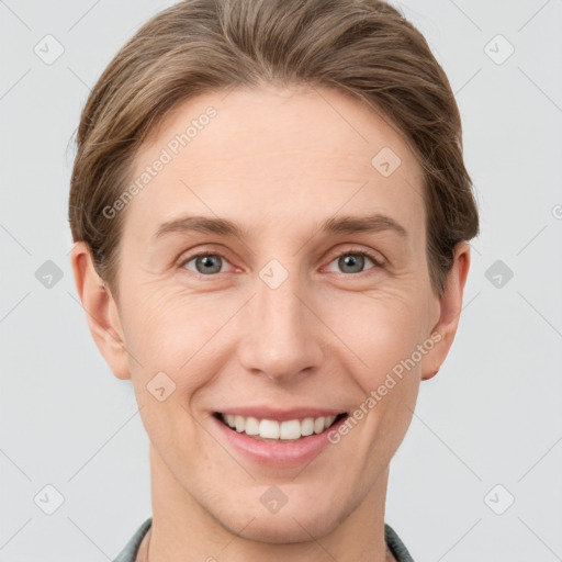 Joyful white young-adult female with short  brown hair and grey eyes