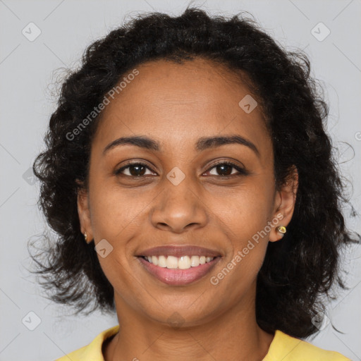 Joyful black young-adult female with medium  brown hair and brown eyes