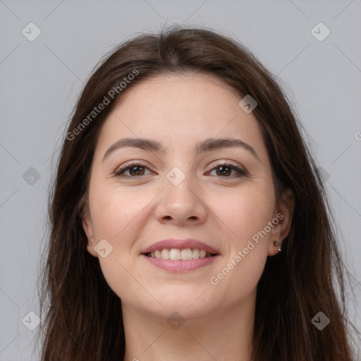 Joyful white young-adult female with long  brown hair and brown eyes