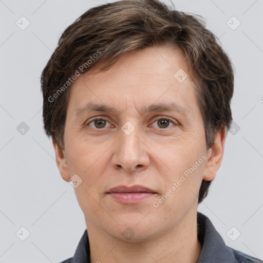 Joyful white adult male with short  brown hair and grey eyes