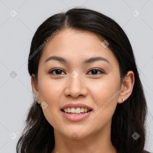 Joyful white young-adult female with long  brown hair and brown eyes