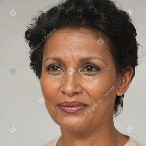 Joyful black adult female with short  brown hair and brown eyes