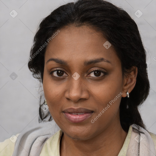 Joyful black young-adult female with long  black hair and brown eyes