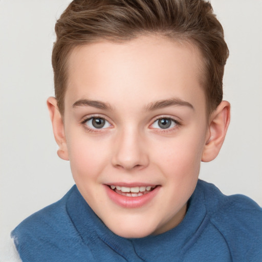 Joyful white child female with short  brown hair and grey eyes