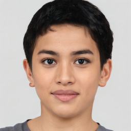 Joyful latino young-adult male with short  brown hair and brown eyes