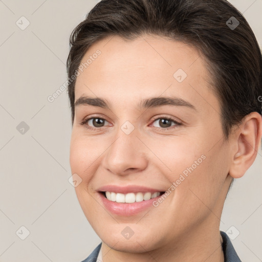 Joyful white young-adult female with short  brown hair and brown eyes