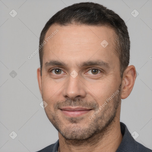 Joyful white adult male with short  brown hair and brown eyes