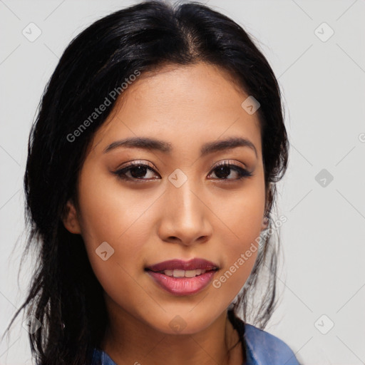 Joyful latino young-adult female with long  black hair and brown eyes