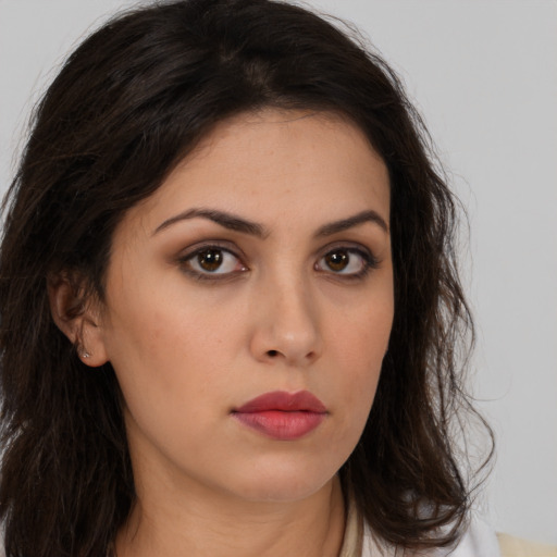 Neutral white young-adult female with long  brown hair and brown eyes