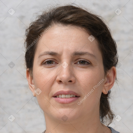 Joyful white adult female with medium  brown hair and grey eyes