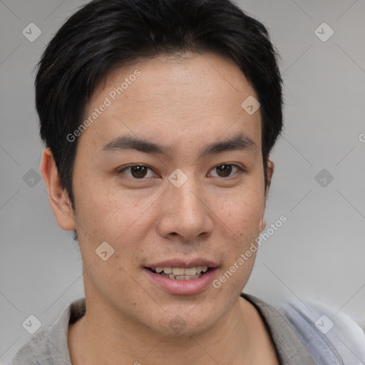 Joyful asian young-adult male with short  brown hair and brown eyes