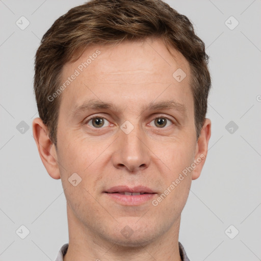 Joyful white adult male with short  brown hair and grey eyes