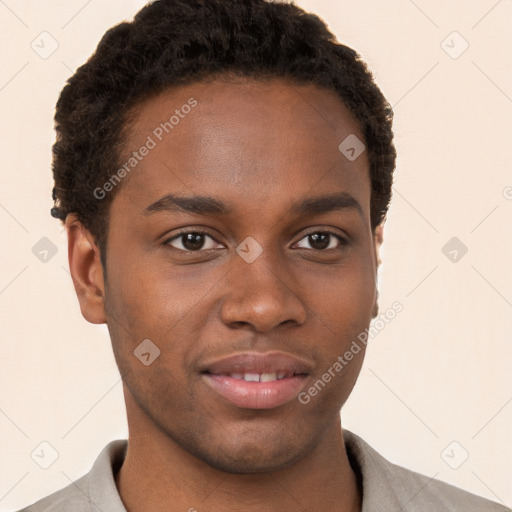 Joyful black young-adult male with short  brown hair and brown eyes