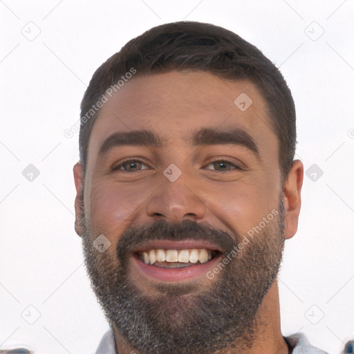 Joyful white young-adult male with short  black hair and brown eyes