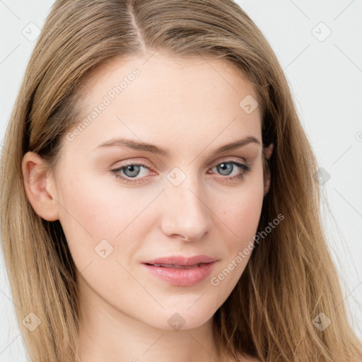 Joyful white young-adult female with long  brown hair and blue eyes