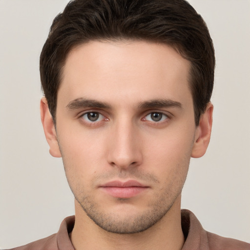 Neutral white young-adult male with short  brown hair and brown eyes