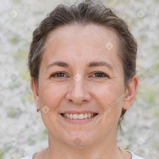 Joyful white adult female with short  brown hair and brown eyes