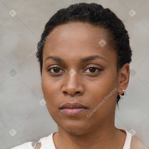 Neutral black young-adult female with short  black hair and brown eyes