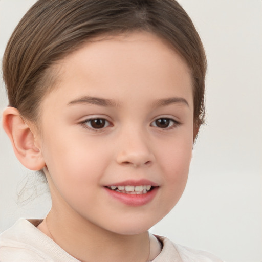 Joyful white child female with short  brown hair and brown eyes