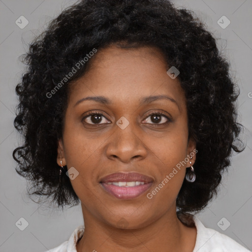 Joyful black adult female with medium  brown hair and brown eyes