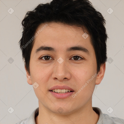 Joyful white young-adult male with short  black hair and brown eyes