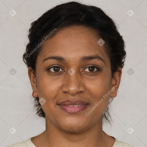 Joyful black young-adult female with short  brown hair and brown eyes