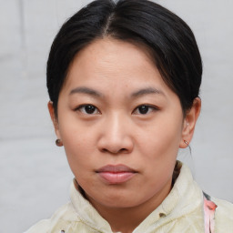 Neutral asian young-adult female with short  brown hair and brown eyes