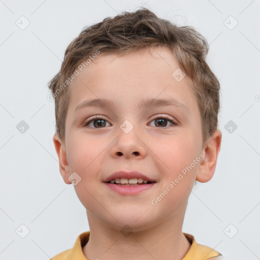 Joyful white child male with short  brown hair and brown eyes