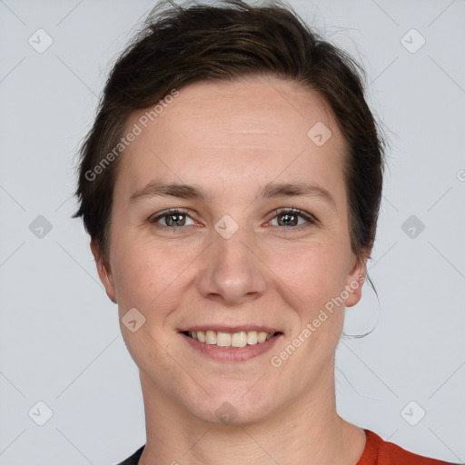 Joyful white young-adult female with short  brown hair and grey eyes