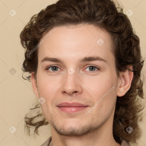 Joyful white young-adult male with medium  brown hair and brown eyes