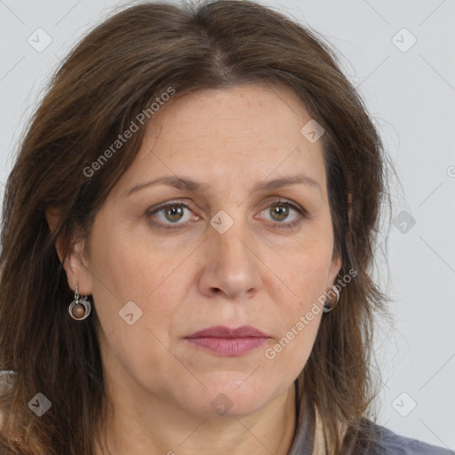 Joyful white adult female with long  brown hair and brown eyes