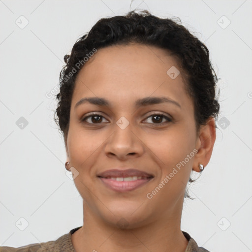 Joyful latino young-adult female with short  brown hair and brown eyes