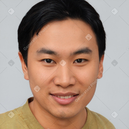 Joyful asian young-adult male with short  brown hair and brown eyes