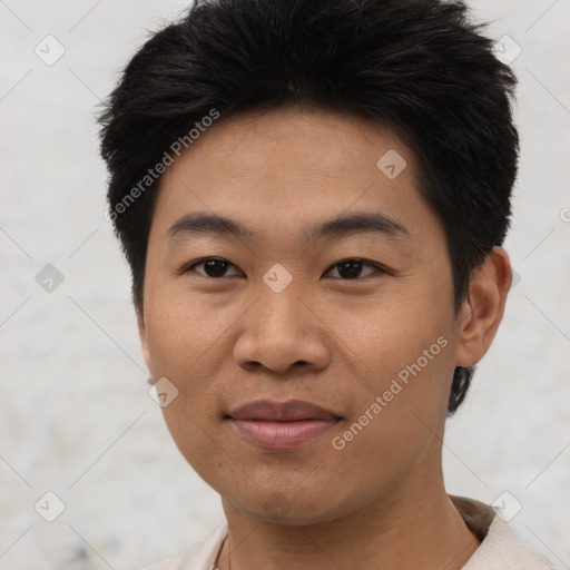 Joyful asian young-adult male with short  black hair and brown eyes