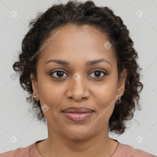 Joyful black young-adult female with medium  brown hair and brown eyes