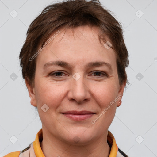 Joyful white adult female with short  brown hair and brown eyes