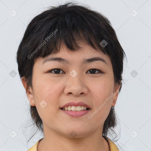 Joyful asian young-adult female with medium  brown hair and brown eyes