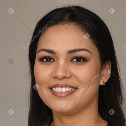 Joyful asian young-adult female with long  brown hair and brown eyes