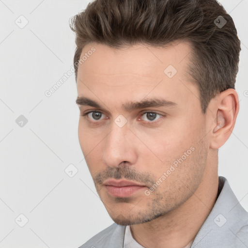 Neutral white young-adult male with short  brown hair and brown eyes