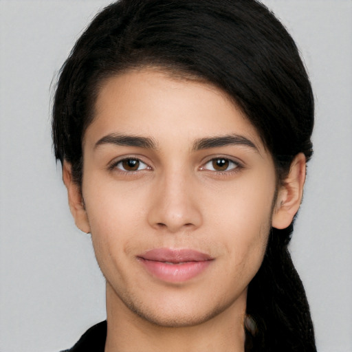 Joyful white young-adult female with long  black hair and brown eyes