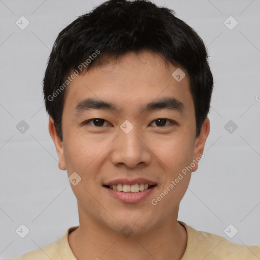 Joyful asian young-adult male with short  black hair and brown eyes