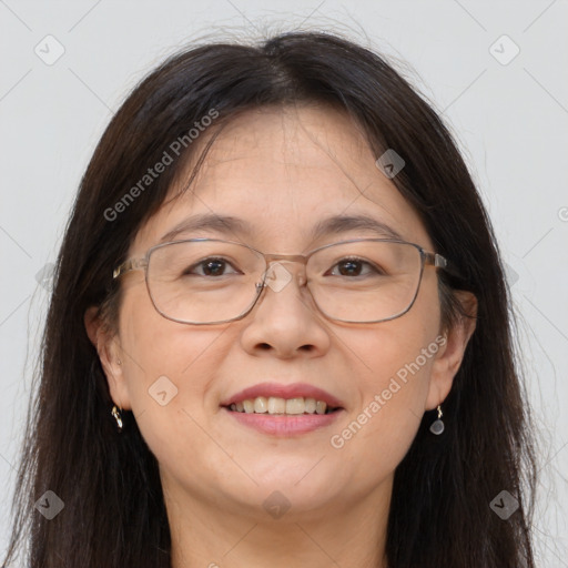 Joyful white adult female with long  brown hair and brown eyes