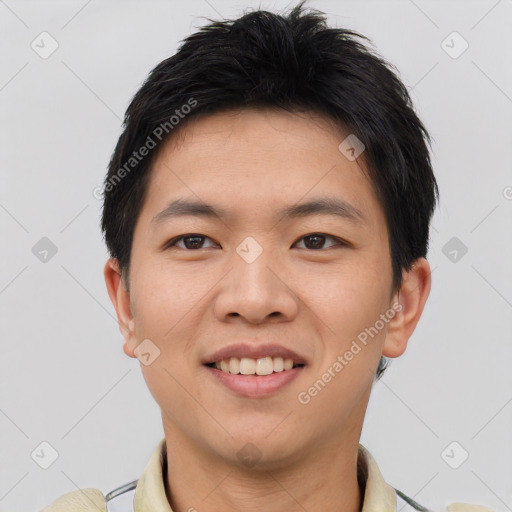 Joyful asian young-adult male with short  brown hair and brown eyes