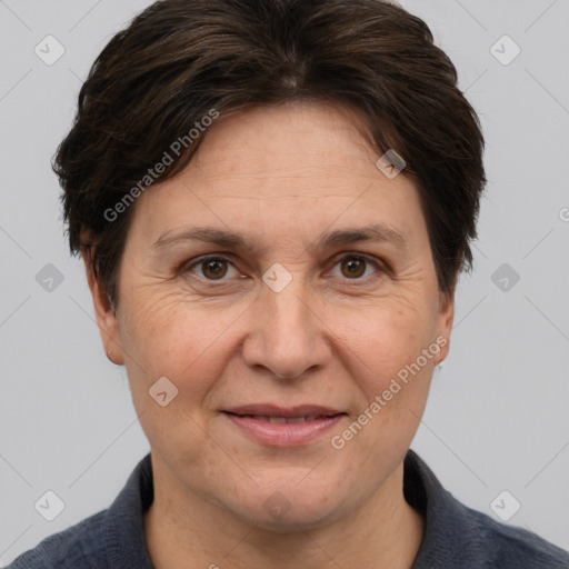 Joyful white adult female with short  brown hair and brown eyes