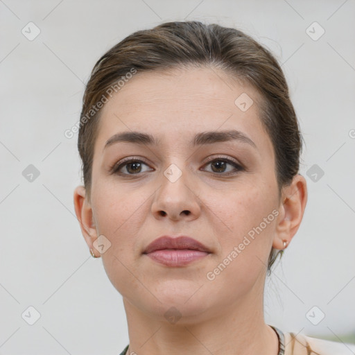 Neutral white young-adult female with short  brown hair and brown eyes