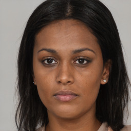 Neutral black young-adult female with long  brown hair and brown eyes