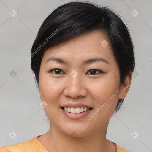 Joyful asian young-adult female with short  brown hair and brown eyes