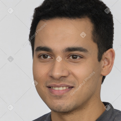 Joyful white young-adult male with short  black hair and brown eyes